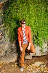 Young Man wearing sunglasses, relaxing at Central Park, New York