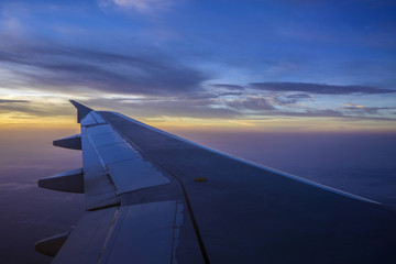 Fototapeta na wymiar Sunrise From an Airplane
