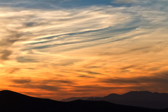 Fototapeta Red sunrise with clouds (sunset) in mountains