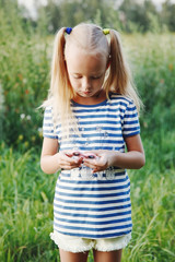 girl holding popular fidget spinner toy