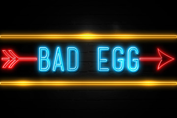 Bad Egg  - fluorescent Neon Sign on brickwall Front view
