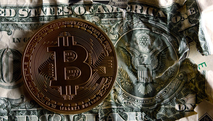 Bitcoin on US seal Crushed dollar banknote