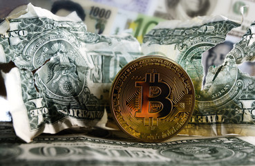Bitcoin on Crushed dollar banknote