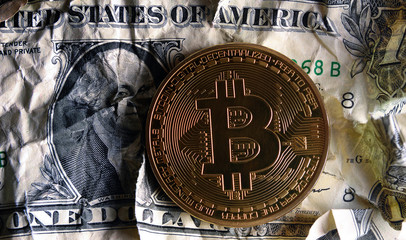 Fototapety  Bitcoin on Crushed dollar banknote