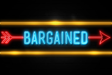 Fototapeta premium Bargained - fluorescent Neon Sign on brickwall Front view