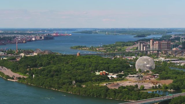 Montreal Quebec Aerial v56 Flying low over St Lawrence river panning with waterfront views