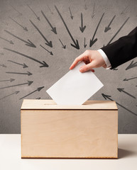 close up of a ballot box and casting vote
