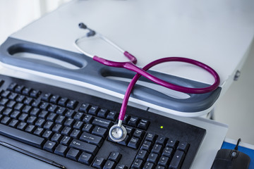 Stethoscope on a computer keyboard at a hospital 