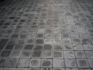 Patterned paving tiles, cement brick floor background.