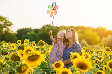 Peel and stick wall murals Sunflower Mom and daughter in the field of sunflowers