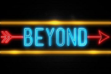 Obraz premium Beyond - fluorescent Neon Sign on brickwall Front view