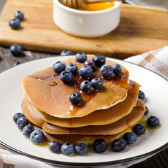 Pancakes with fresh blueberry and honey