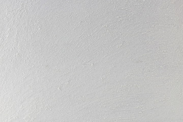 Strukturierte gekörnte weiße Wand.