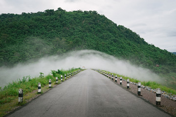 Fog flow at mountain landscape