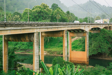cement bridge across the mountains landscape