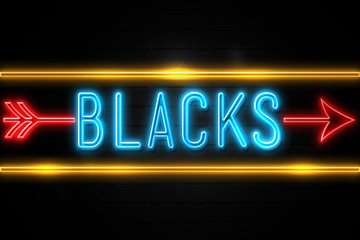 Blacks  - fluorescent Neon Sign on brickwall Front view