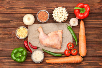 Composition with ingredients for delicious turkey chili on wooden background