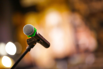 Dynamic microphone on blurred background, closeup