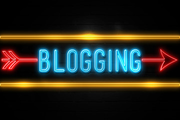 Blogging  - fluorescent Neon Sign on brickwall Front view