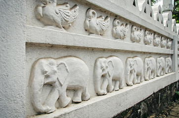 A concrete fence with national ornament in Sri Lanka