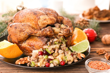 Roasted turkey with stuffing served on holiday table