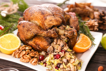 Roasted turkey with stuffing served on holiday table