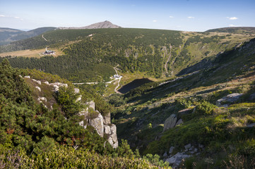 Fototapeta na wymiar View on a path and mountain lake with Śnieżka in the background in Karkonosze mountains, Poland
