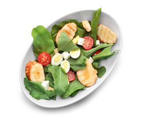 Salad with quail eggs and spinach in bowl isolated on white