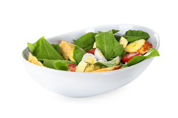 Salad with quail eggs and spinach in bowl isolated on white