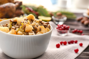 Turkey stuffing in white ceramic bowl on kitchen table