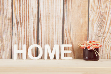 Home made jam on wooden background