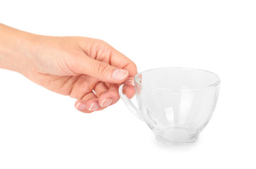 female hand holding transparent glass cup. Isolated on white background