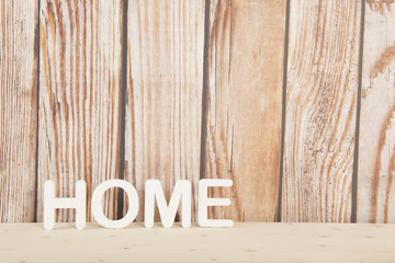 Home on wooden background