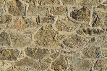 A stony wall of the ancient building