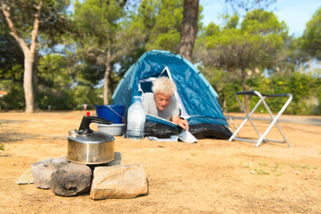 Man alone with tent for adventure camping