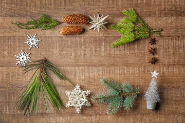 Frame made of Christmas decor on wooden background