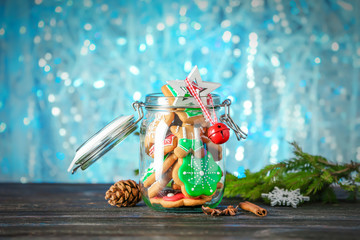Tasty Christmas homemade cookies in jar on blurred background