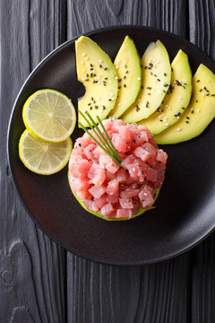 tartare of fresh raw tuna with spices close-up. Vertical top view