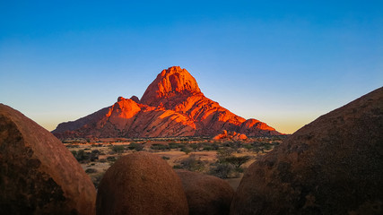 Spitzkoppe mountains illuminated at sunrise 
