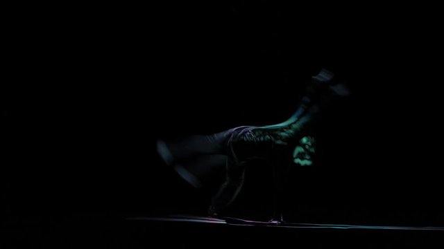 Brake dance perform silhouette man on black background, computer graphics