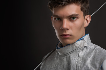 Portrait of Handsome Young male fencer wearing