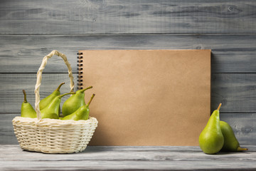 Fresh pears in basket with scratch pad mock-up