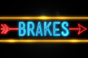 Brakes  - fluorescent Neon Sign on brickwall Front view