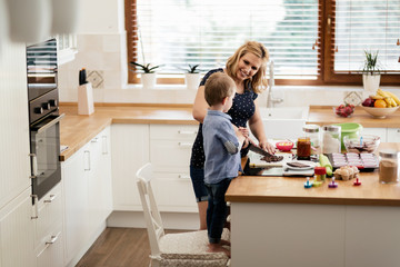 Mother and child preparing cookies