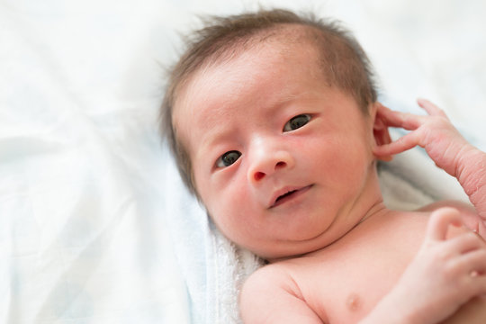 Closeup of asian newborn baby boy