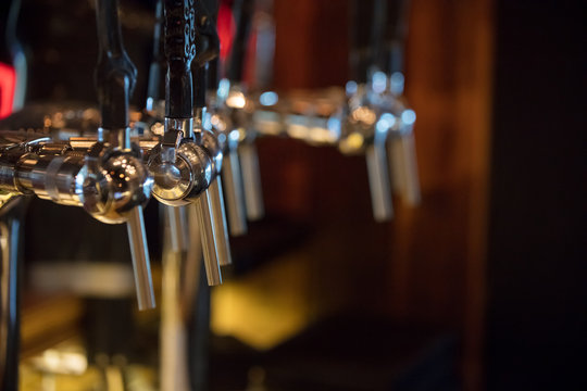 Cranes keg with work instrument tap handles close up