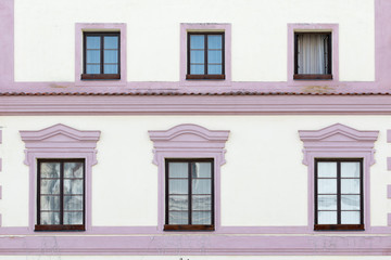 Třeboň, Czech Republic - August 18, 2017: old condominiums flanked by the streets of the city, with a row of windows