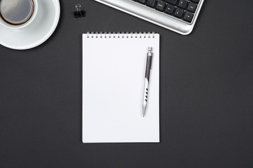 Business objects on a black desk.