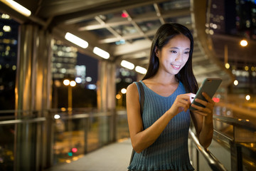 Woman use of mobile phone at night