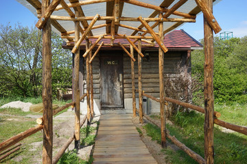 Design rustic toilet in an open space amidst nature